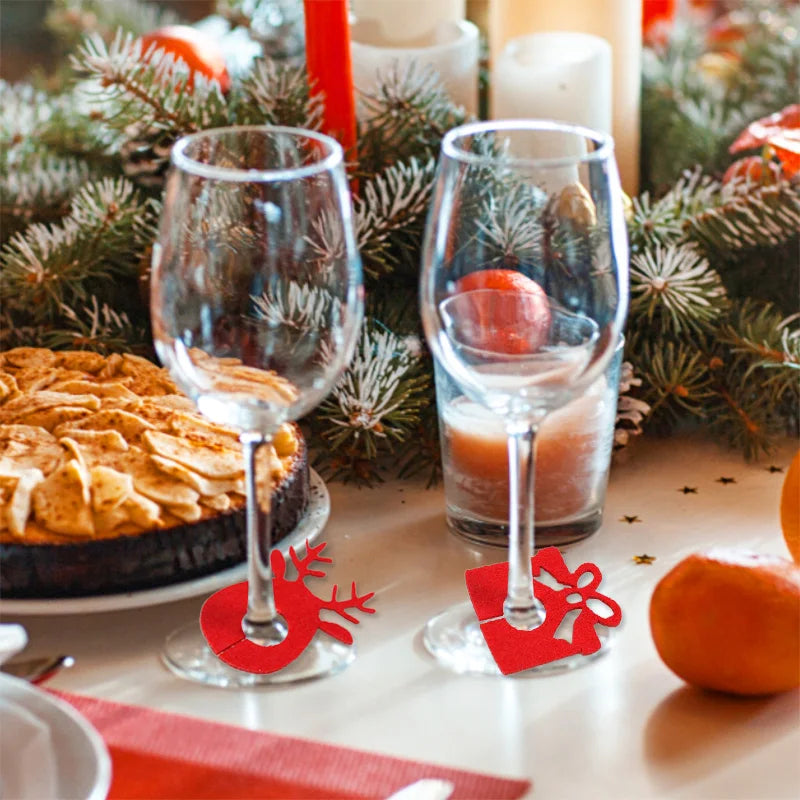Christmas wine glass charms set featuring festive designs on elegant wine glasses at a holiday table