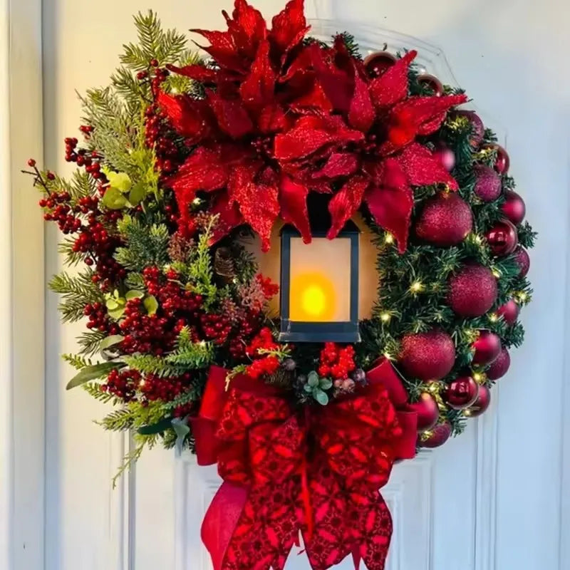 Beautiful Christmas Wreath with red flowers, ornaments, and a lantern for festive home decor