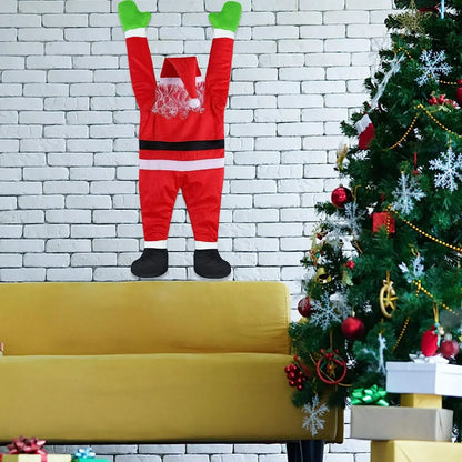 Climbing Santa Claus decoration mounted on a wall with festive holiday decor nearby