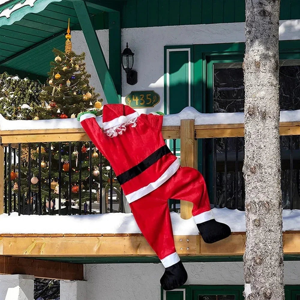 Nutshell Climbing Santa Claus Decoration Hanging from a Balcony with Snow on the Ground