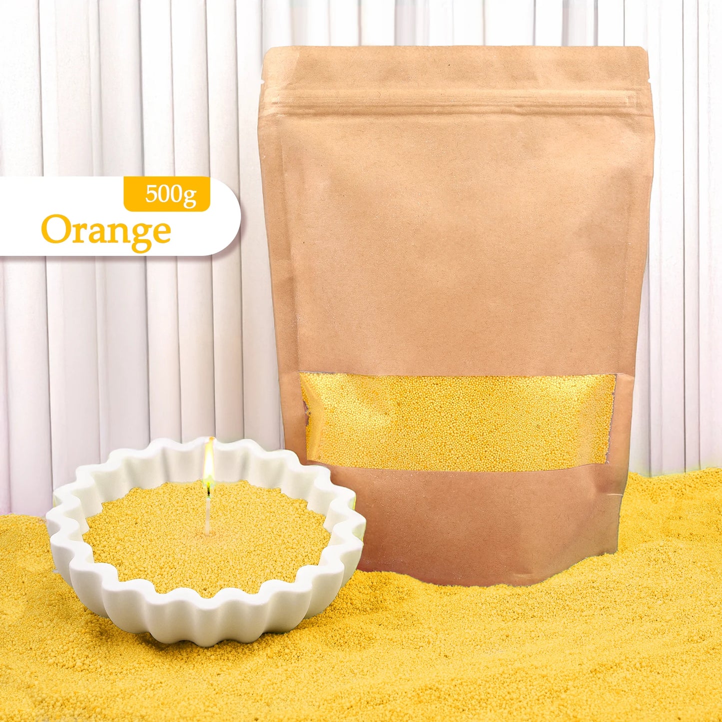 Nutshell orange colored candle sand 500g bag with white candle holder filled with orange colored candle sand