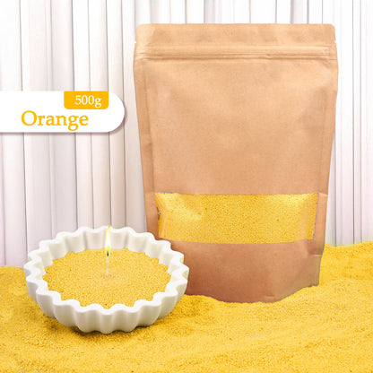 Nutshell orange colored candle sand 500g bag with white candle holder filled with orange colored candle sand