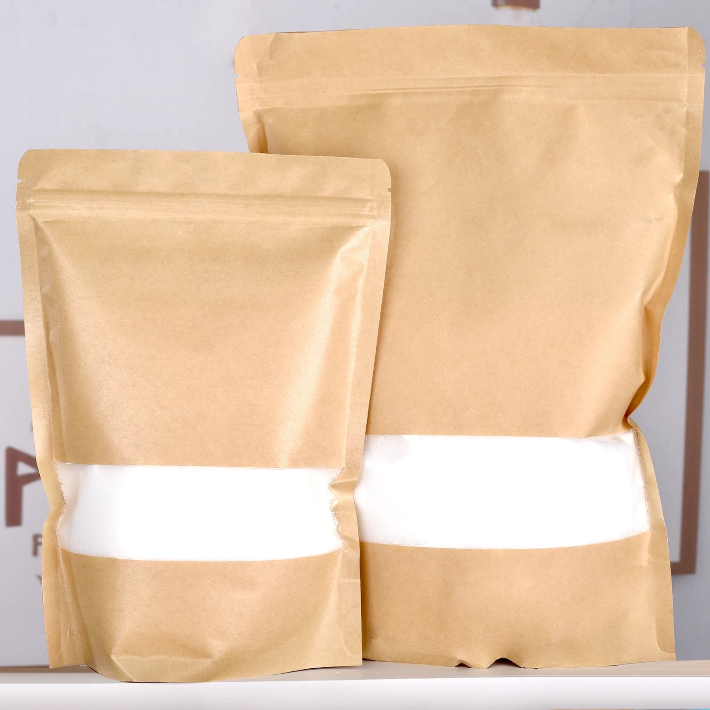 Nutshell natural brown paper bags filled with white colored candle sand for candle making