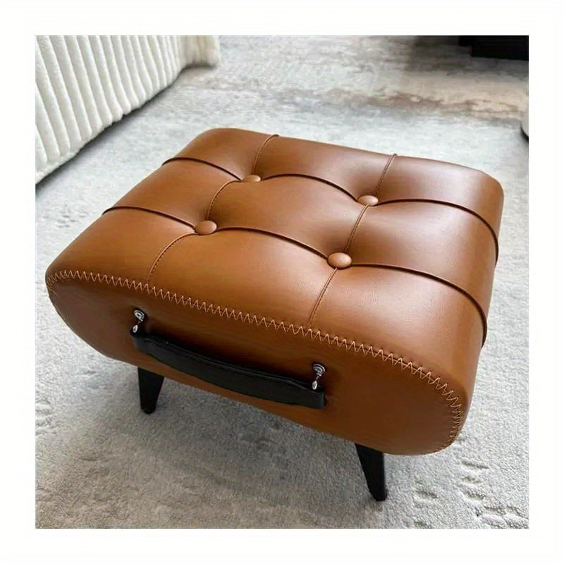 Nutshell comfortable faux leather footrest with tufted design and sturdy legs, perfect for relaxing
