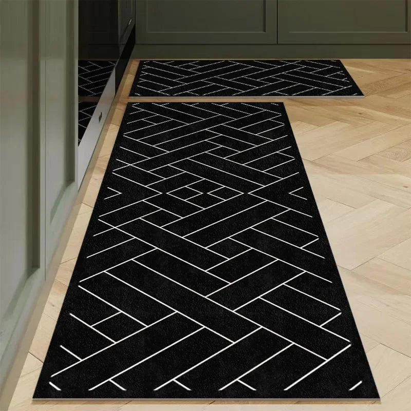 Nutshell Anti Slip Kitchen Floor Mat black geometric runner and matching small mat on light wood kitchen floor