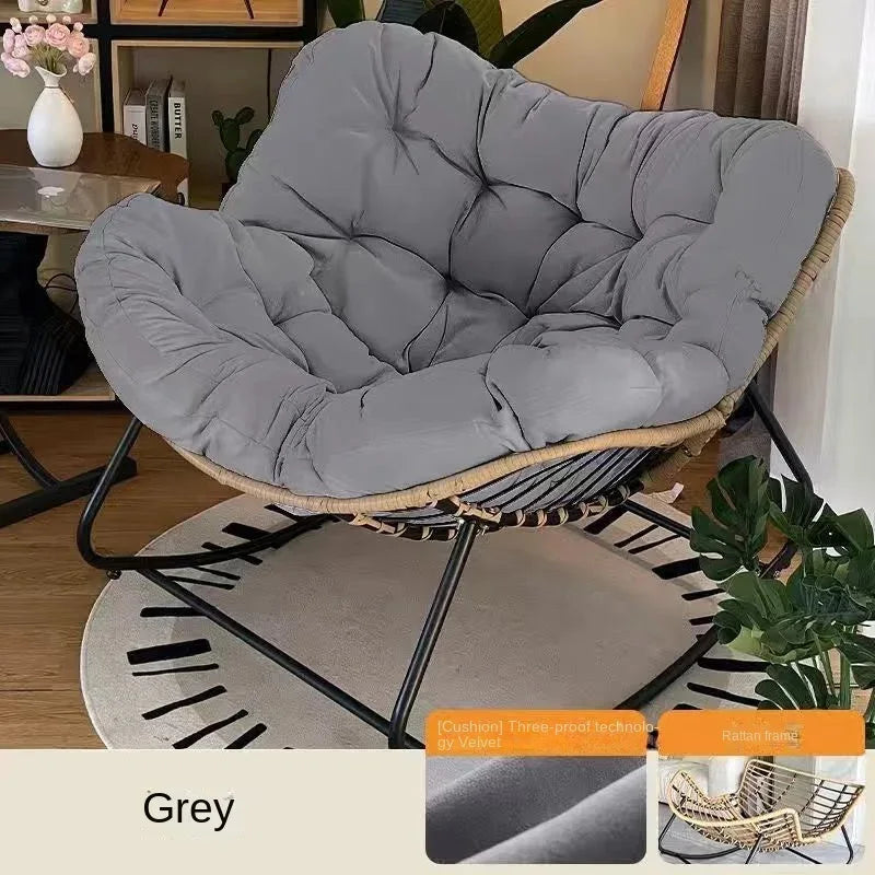 Nutshell grey rattan bowl chair on black metal rocker base lazy leisure rocking chair with cushion for cozy living room