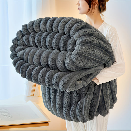 Nutshell luxury faux fur throw blanket oversized plush ribbed gray throw held by woman in cozy room