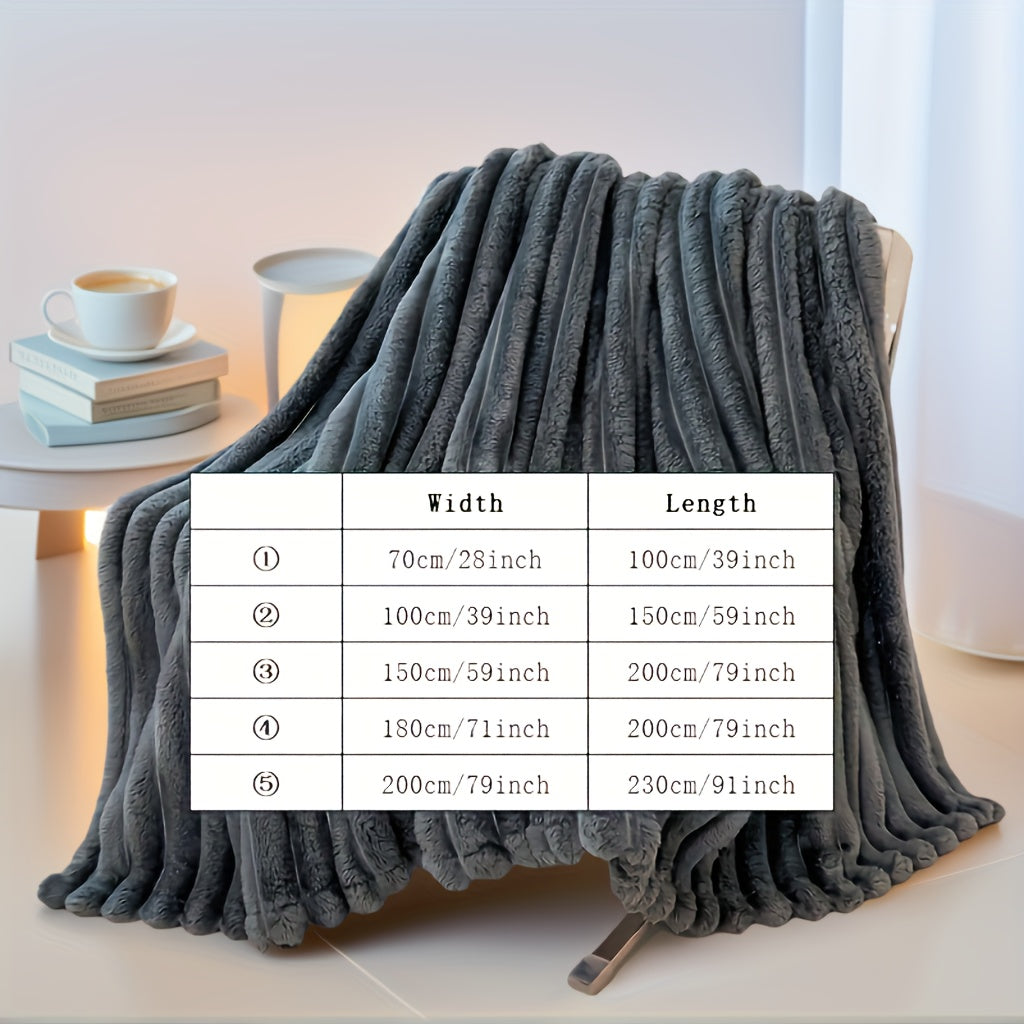 Nutshell luxury faux fur throw blanket plush ribbed charcoal gray draped over chair with coffee and size chart