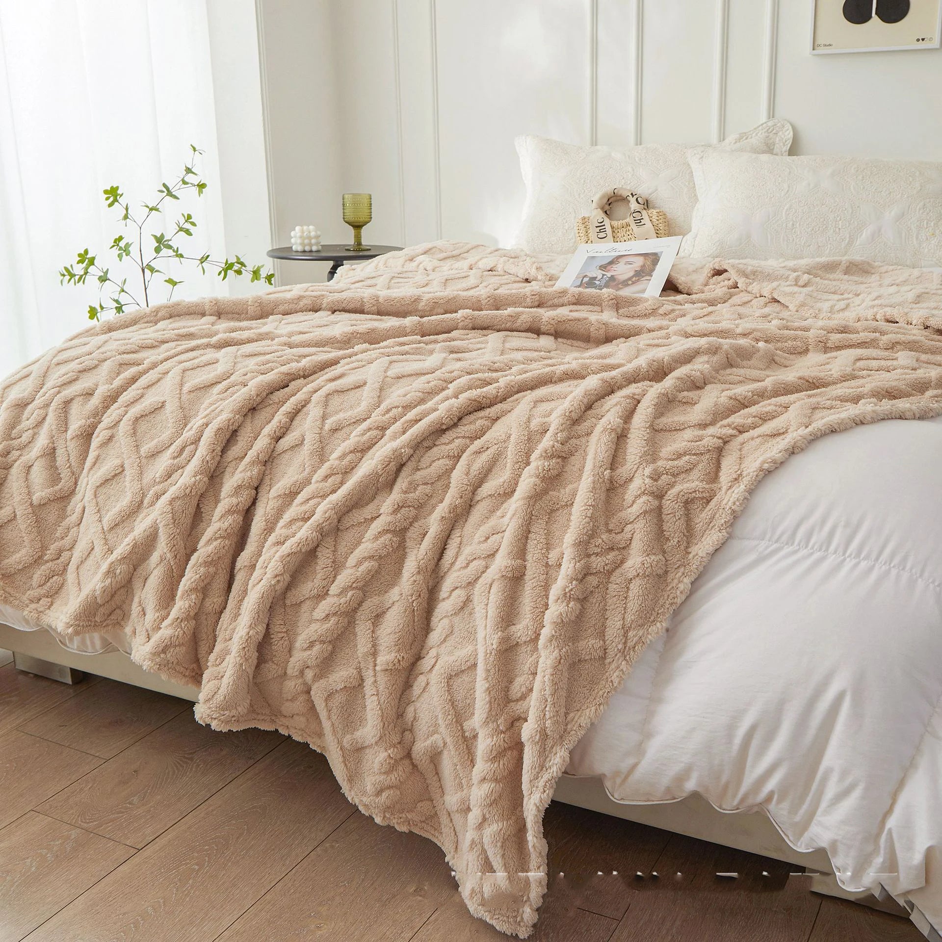 Nutshell beige plush cable knit warm sofa throw blanket draped over bed providing cozy texture and soft warmth