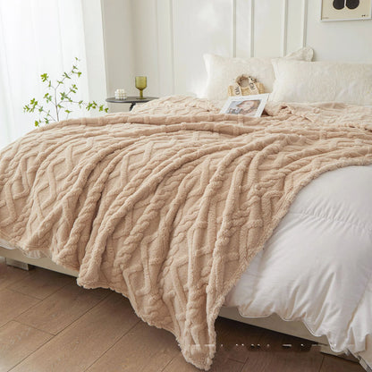 Nutshell beige plush cable knit warm sofa throw blanket draped over bed providing cozy texture and soft warmth