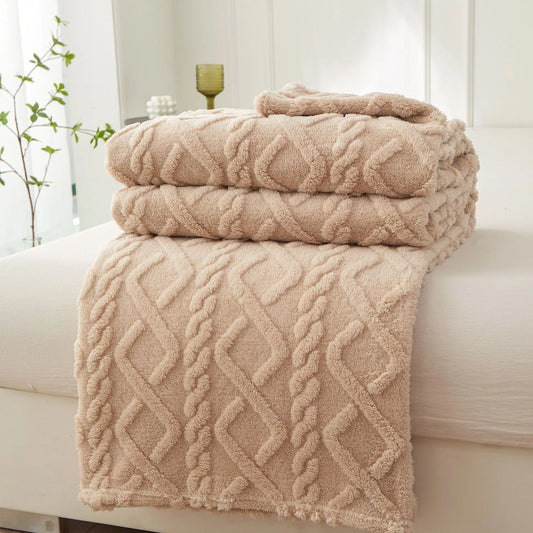 Nutshell beige plush cable knit warm sofa throw blanket folded on sofa for cozy living room