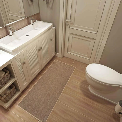 Nutshell washable non-slip kitchen rug beige runner in bathroom by sink and toilet on wood tile floor