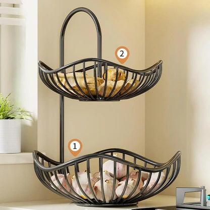 Nutshell two-tier decorative fruit storage rack in black metal holding bread and garlic