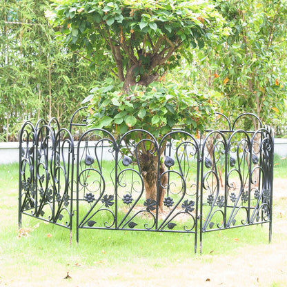 Nutshell black decorative garden fence panels with floral design surrounding tree on green lawn