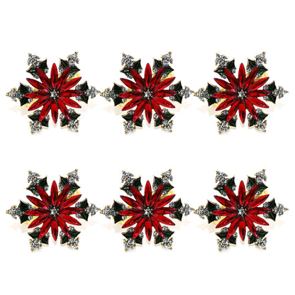 Elegant Christmas napkin rings set featuring red and silver star designs for festive table settings