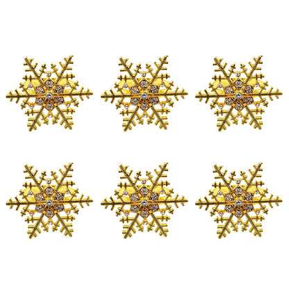Gold snowflake Christmas napkin rings set with sparkling accents for festive table decor