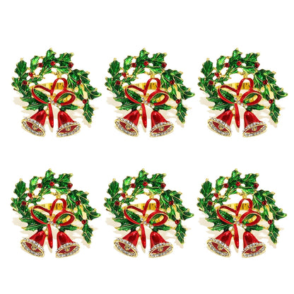 Set of six decorative Christmas napkin rings featuring bells and holly leaves for festive table settings