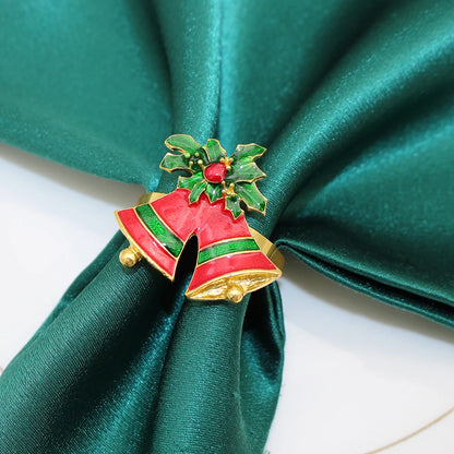 Colorful Christmas napkin rings set featuring red bells with holly for festive table settings