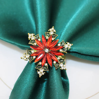 Elegant Christmas napkin rings set featuring a red flower design with sparkling accents
