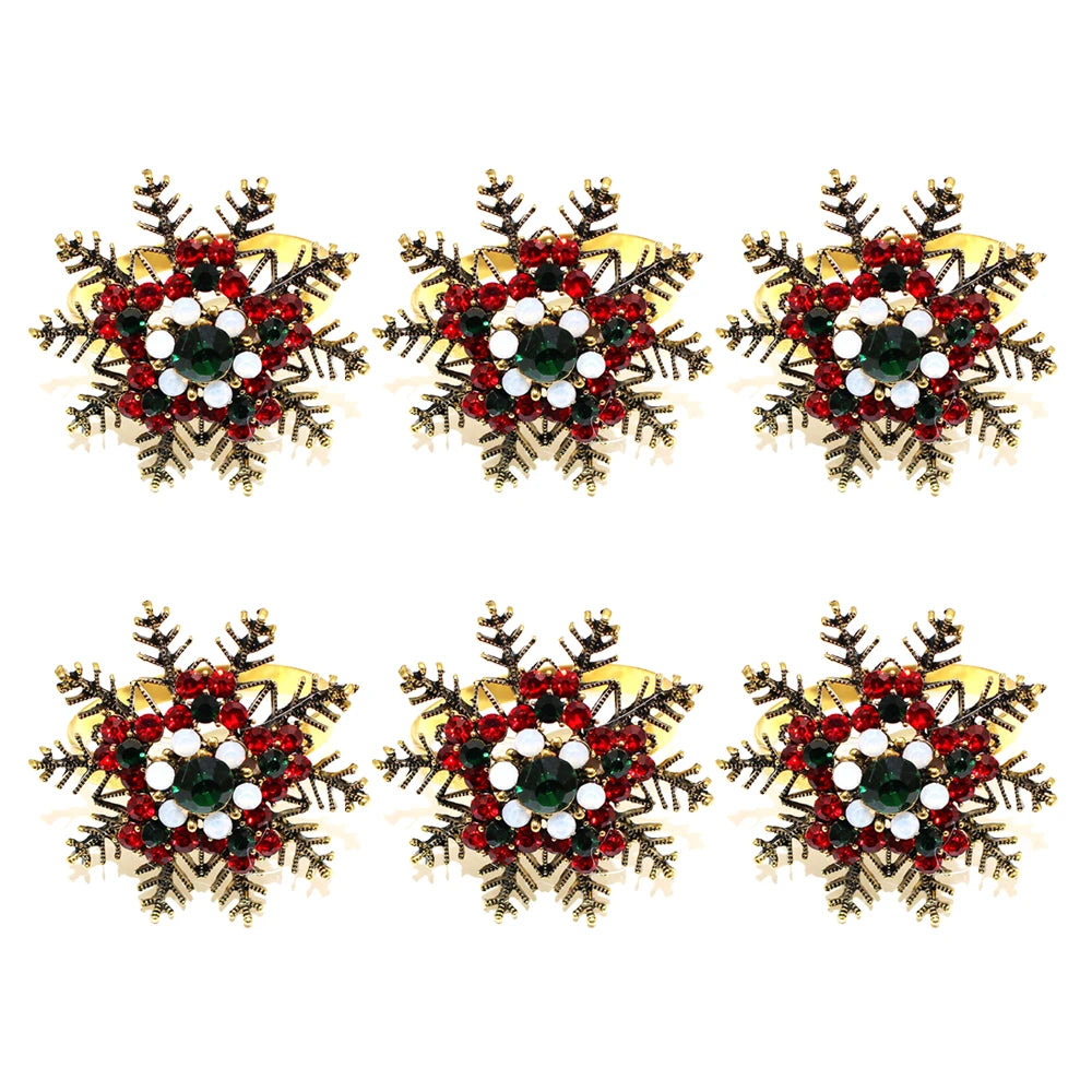 Christmas napkin rings set featuring snowflake designs embellished with red and green decorations