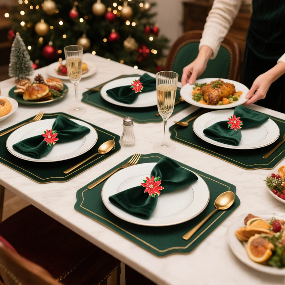 Elegant Christmas Red Poinsettia Napkin Rings on green napkins for festive dinner table setting