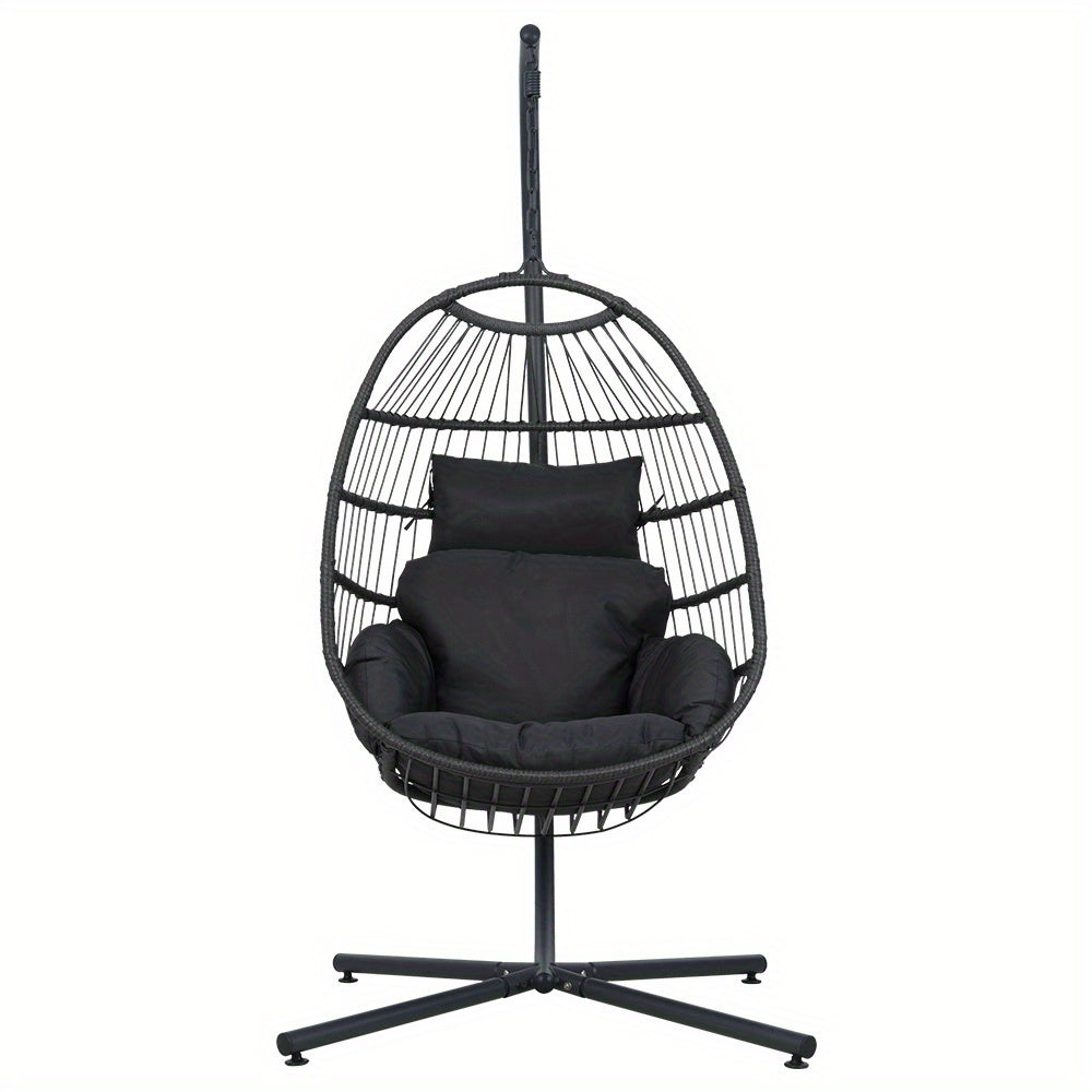 Nutshell black egg swing chair with stand featuring cushioned seating and pillow for indoor or outdoor use