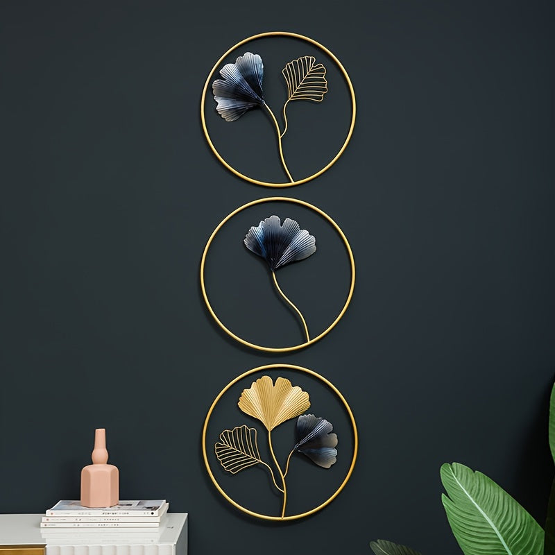European style wall art featuring three circular metal frames with decorative leaf designs in gold and blue
