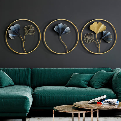 Set of three European style wall art pieces featuring floral designs in gold and blue against a dark wall