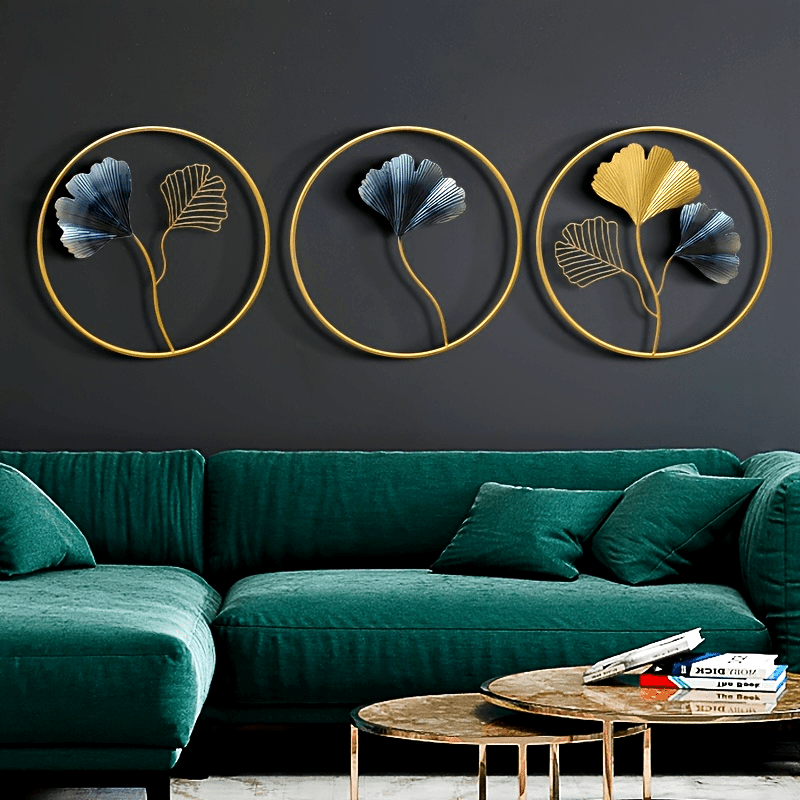 European style wall art featuring three circular designs with gold and blue floral accents on a dark wall