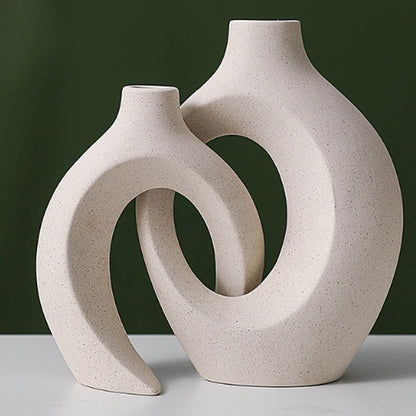 European style white plastic vase set featuring unique curved designs for modern decor
