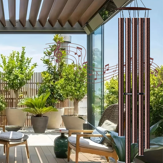 Nutshell extra large aluminium chimes outdoor hanging in a modern patio filled with greenery
