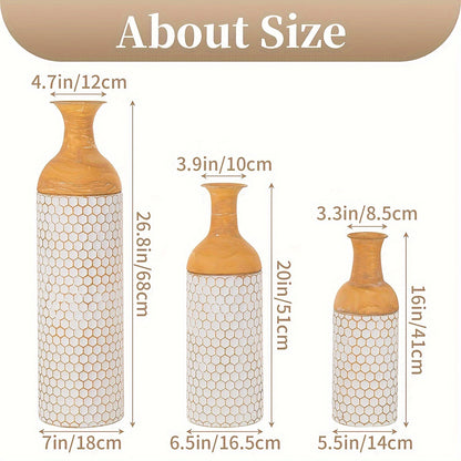 Three extra large metal floor vases with a stylish design and varying heights and widths