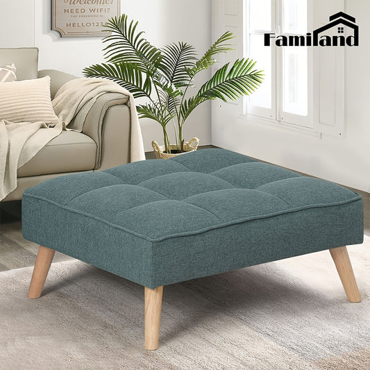 Nutshell tufted linen footstool in teal with wooden legs, perfect for stylish living rooms