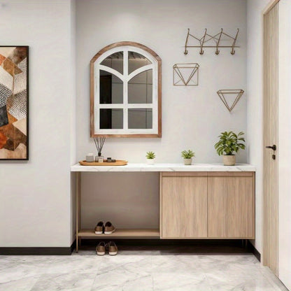 Nutshell farmhouse arched mirror in a modern entryway above a minimalist console table
