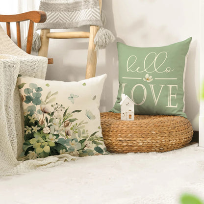 Farmhouse eucalyptus pillow covers by Nutshell featuring green floral and hello love designs on decorative cushions