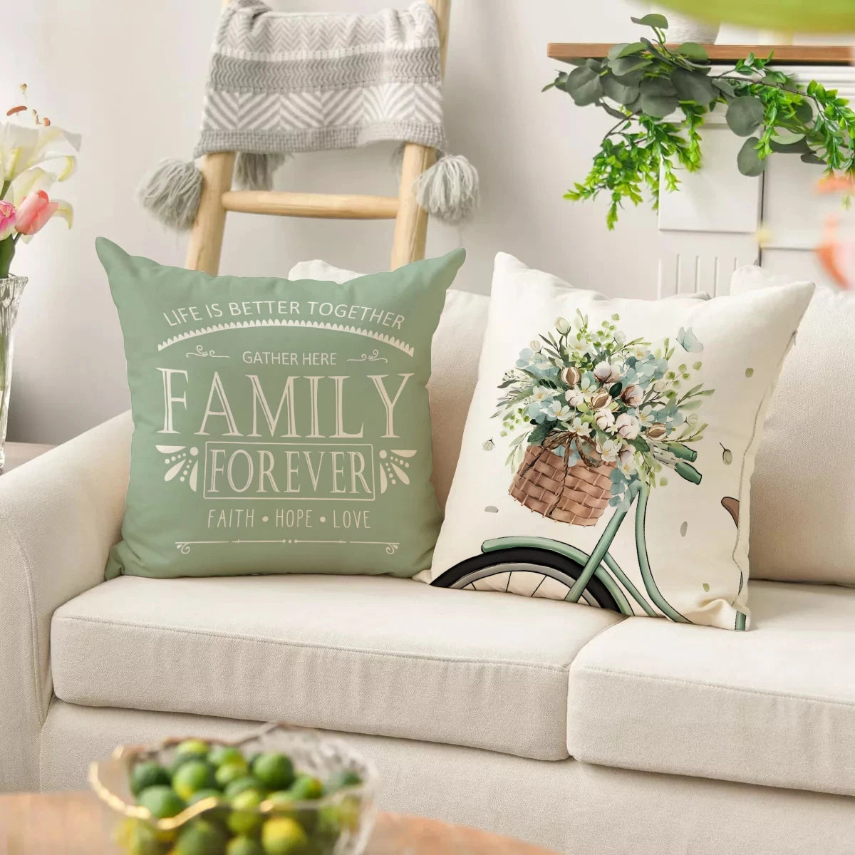 Farmhouse eucalyptus pillow covers with family quote and floral bicycle design on sofa