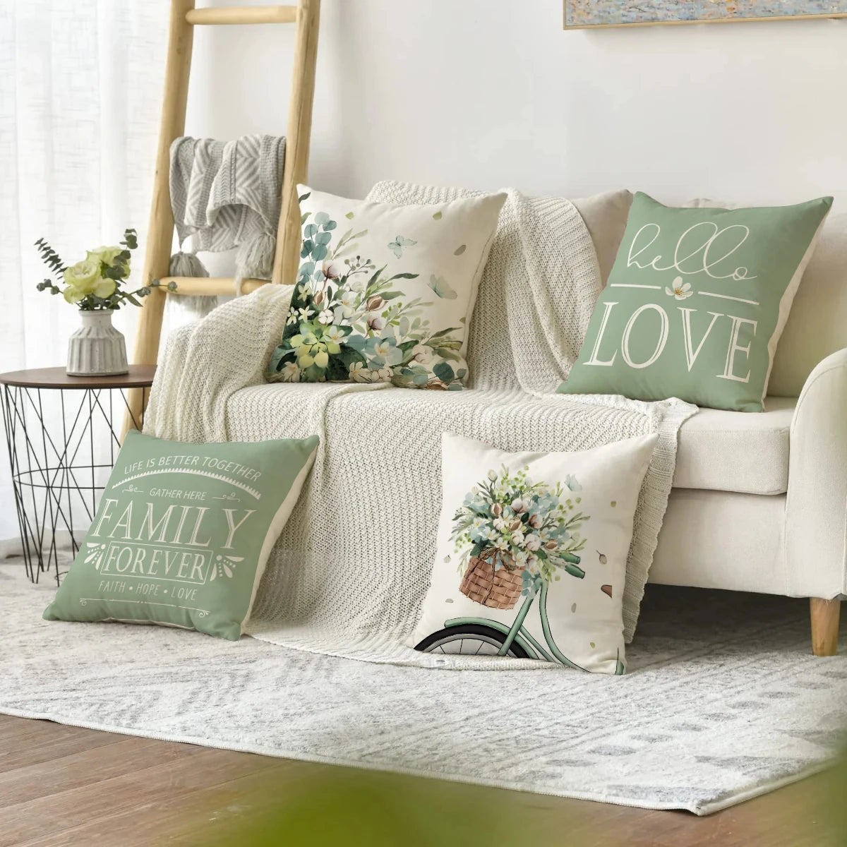 Farmhouse eucalyptus pillow covers on decorative cushions arranged on white sofa with knitted throw