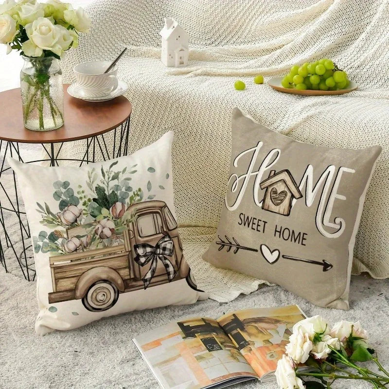 Farmhouse living room accent pillows with vintage truck and home sweet home design on couch