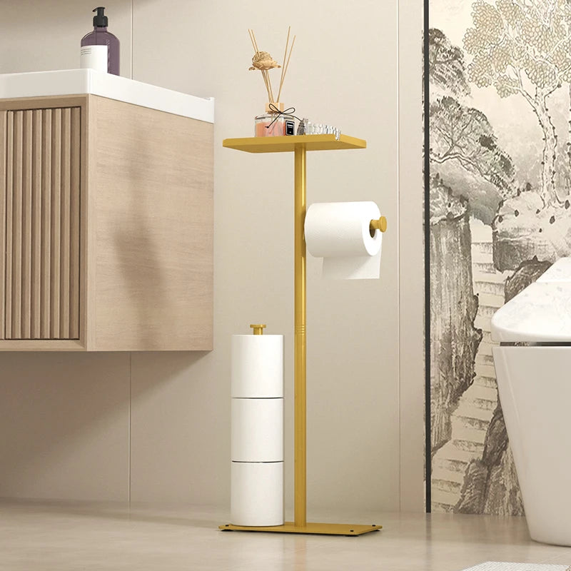 Modern floor standing toilet roll paper rack with storage shelf in stylish golden finish