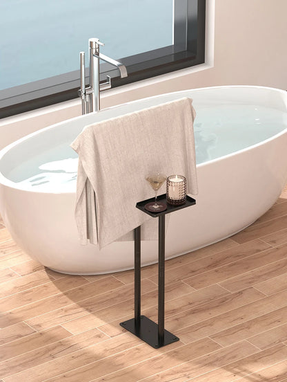 Modern floor standing towel rack with shelf next to a stylish bathtub for convenient storage