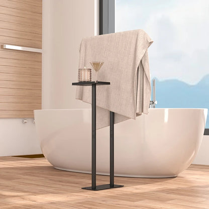 Stylish floor standing towel rack with shelf holding a towel and a drink near a modern bathtub