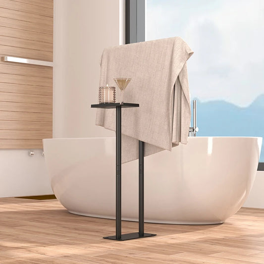 Stylish floor standing towel rack with shelf holding a towel and a drink near a modern bathtub