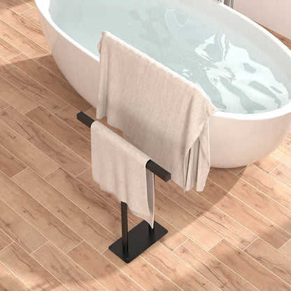 Stylish floor standing towel rack with shelf featuring soft towels beside a modern bathtub