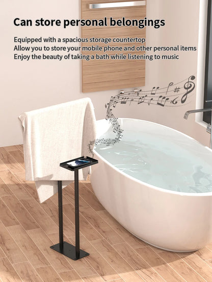 Floor standing towel rack with shelf designed for storage next to a stylish bathtub