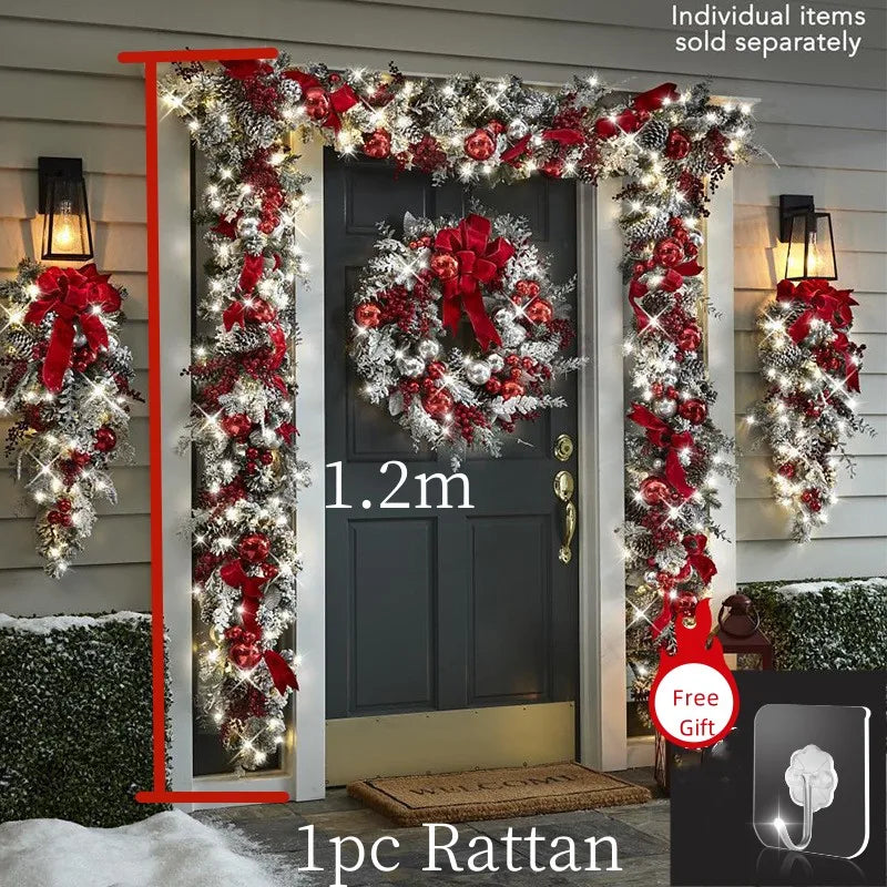 Front door Christmas garland decorations with red ribbons, wreath, and warm white lights for festive entryways