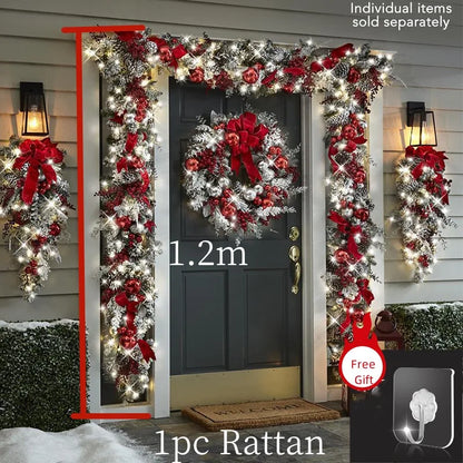 Front door Christmas garland decorations with red ribbons, wreath, and warm white lights for festive entryways