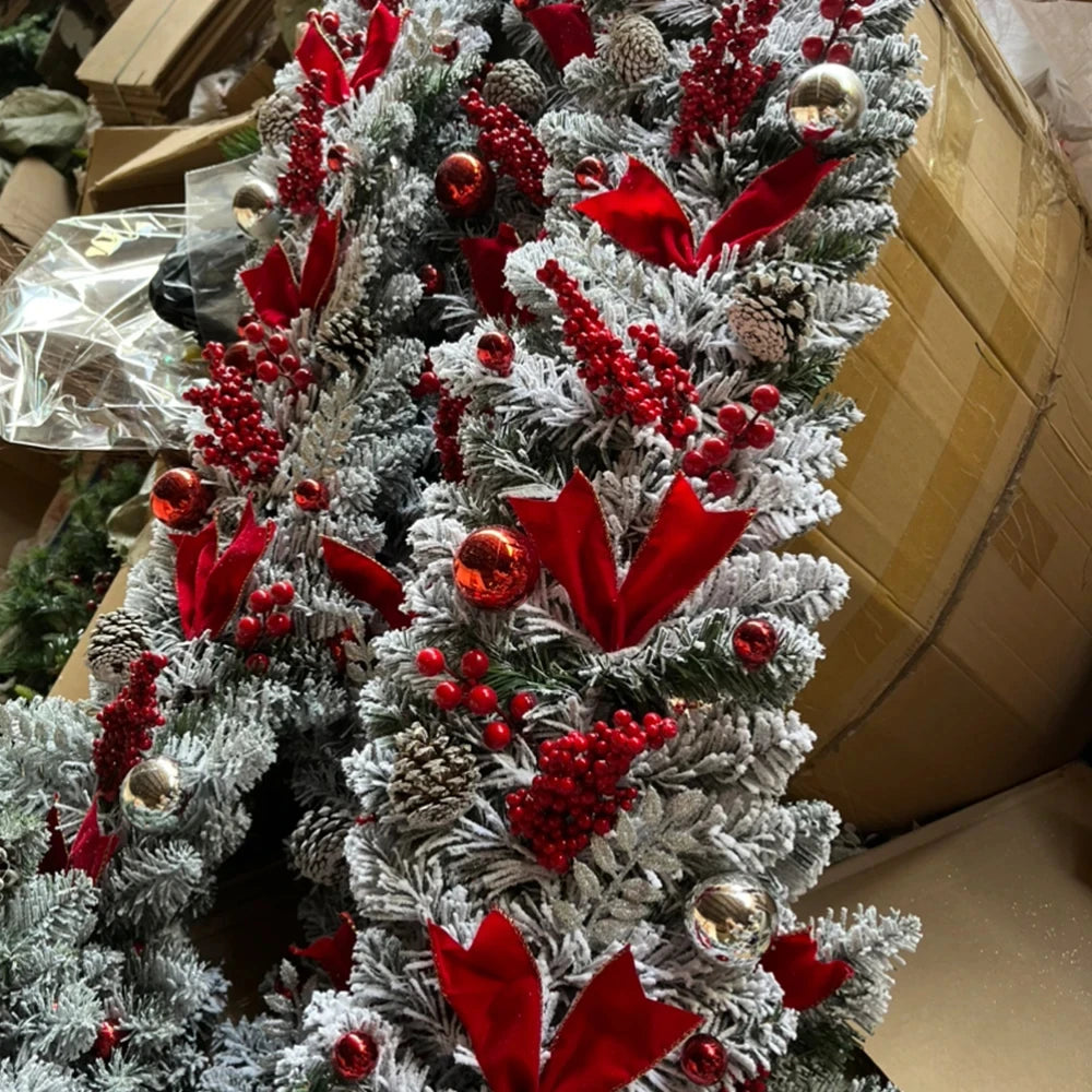 Beautiful front door Christmas garland decorations featuring pinecones, red flowers, and festive ornaments