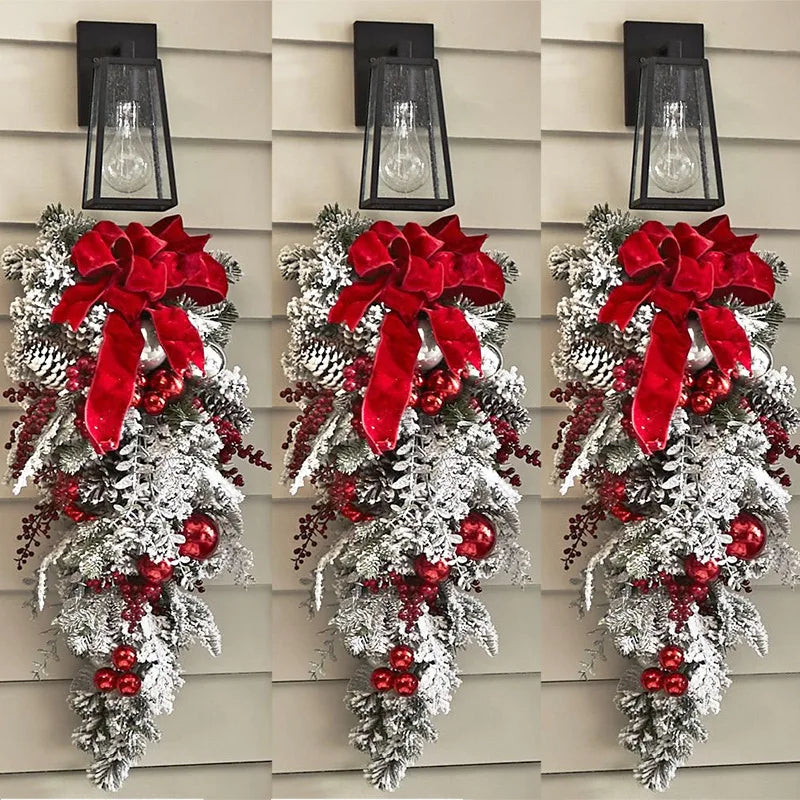 Nutshell front door Christmas garland decorations with red ribbons, pinecones, and berries for festive holiday appeal