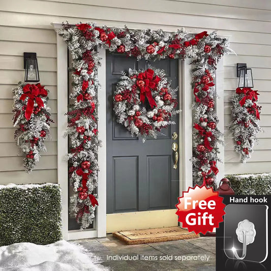 Festive front door Christmas garland decorations with red bows and ornaments on a winter home entrance