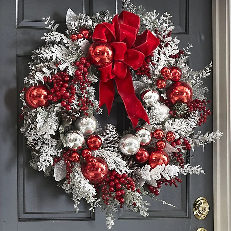Front door Christmas garland decorations with red and silver ornaments and a large red bow
